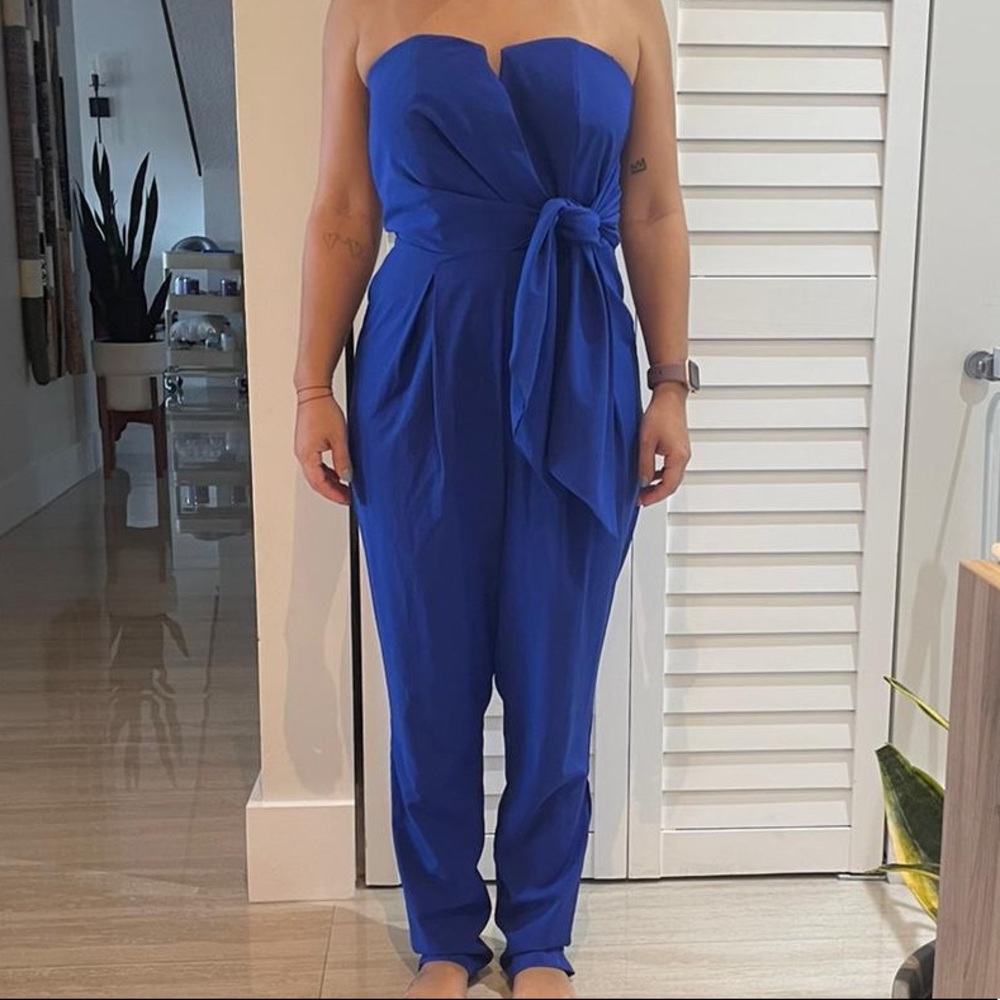 Royal blue strapless jumpsuit with tie detail and boning.